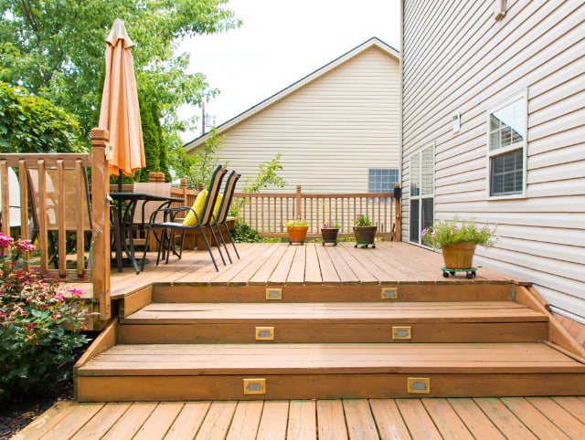 Custom deck building, outdoor living space, backyard deck, deck construction